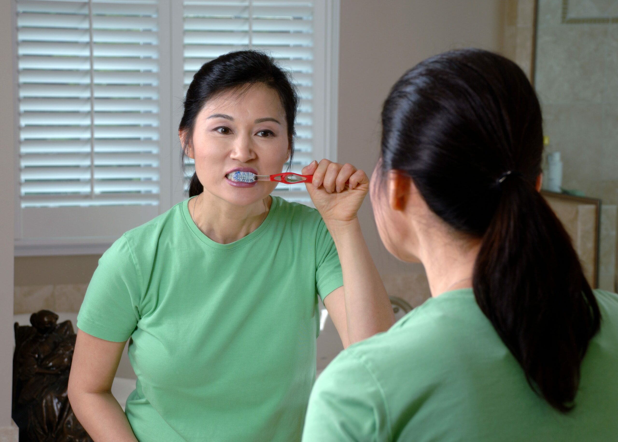 Woman brushing teeth